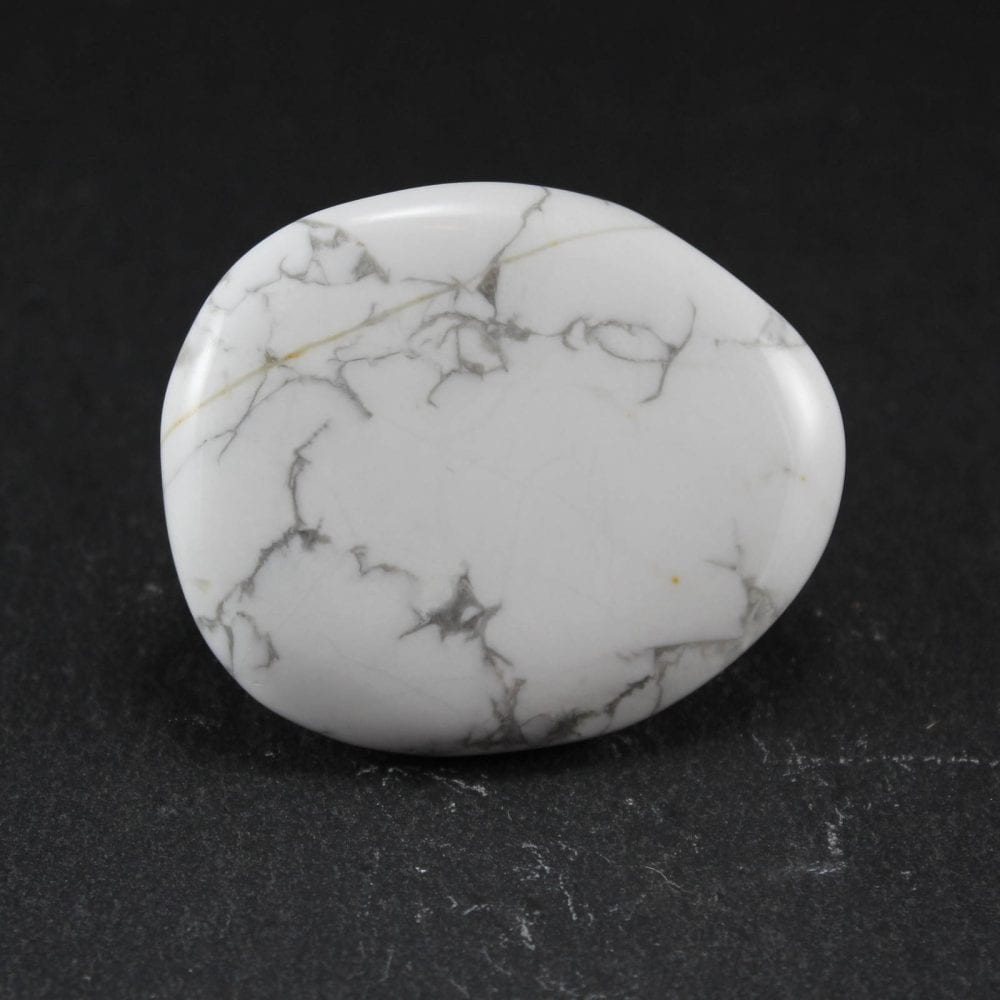 White Howlite palmstones - also known as thumbstones.