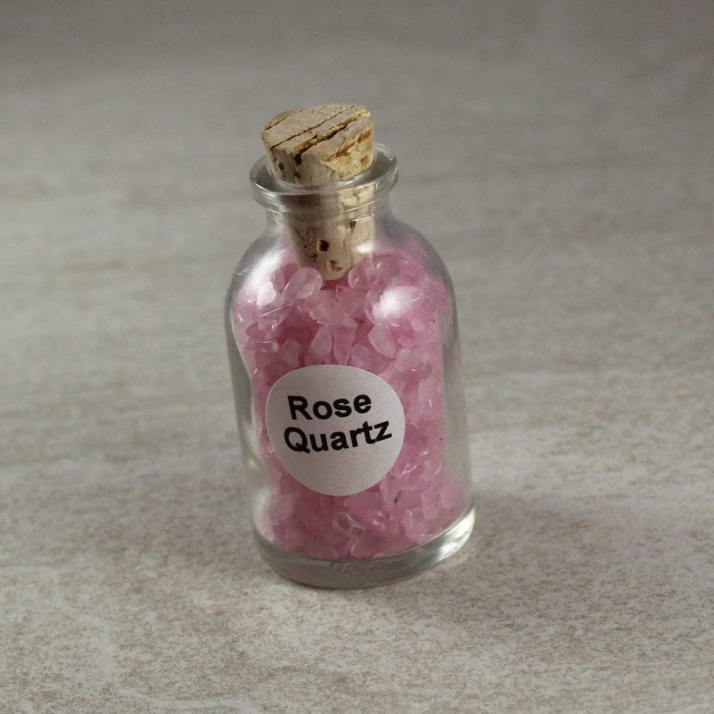 rose quartz crystal chips in a bottle