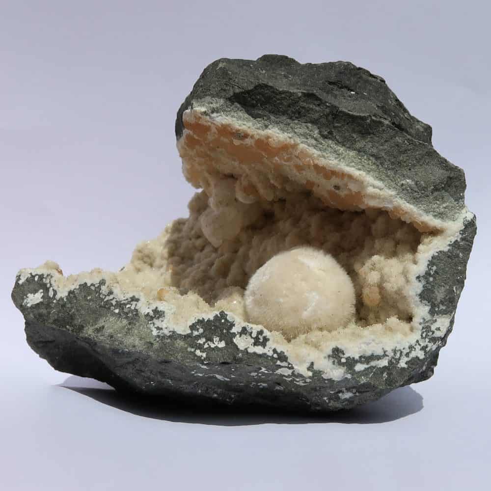 okenite gyrolite and calcite in quartz geode from india 8